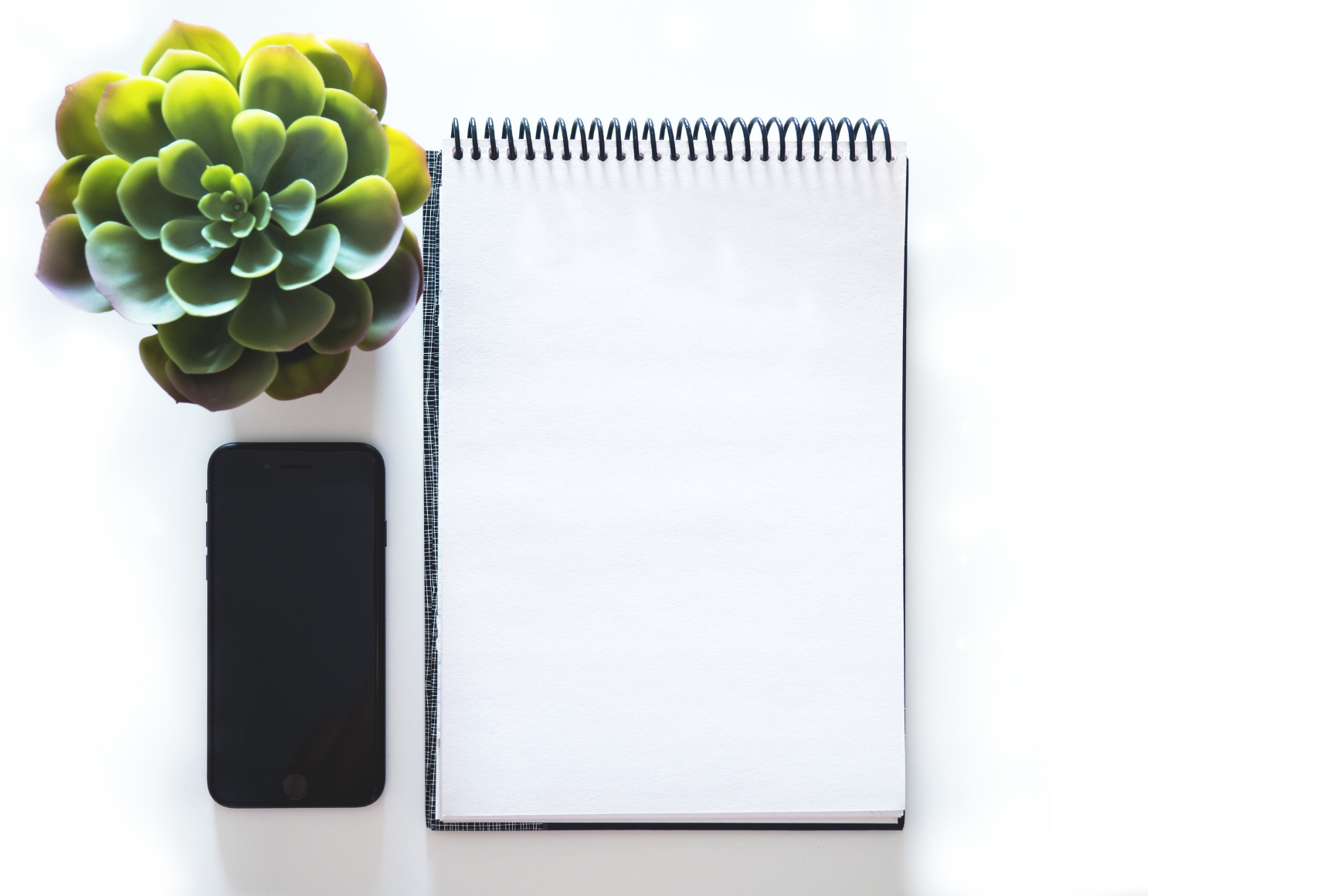 Phone and notebook on a desk