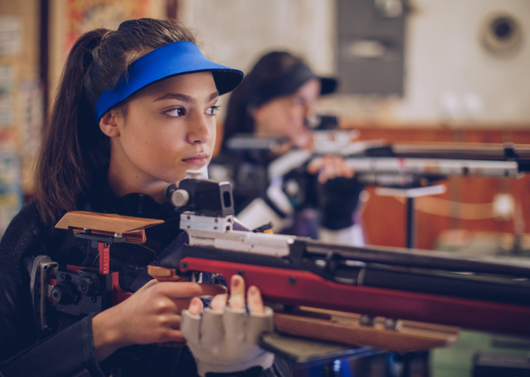 Pupil aiming an air rifle